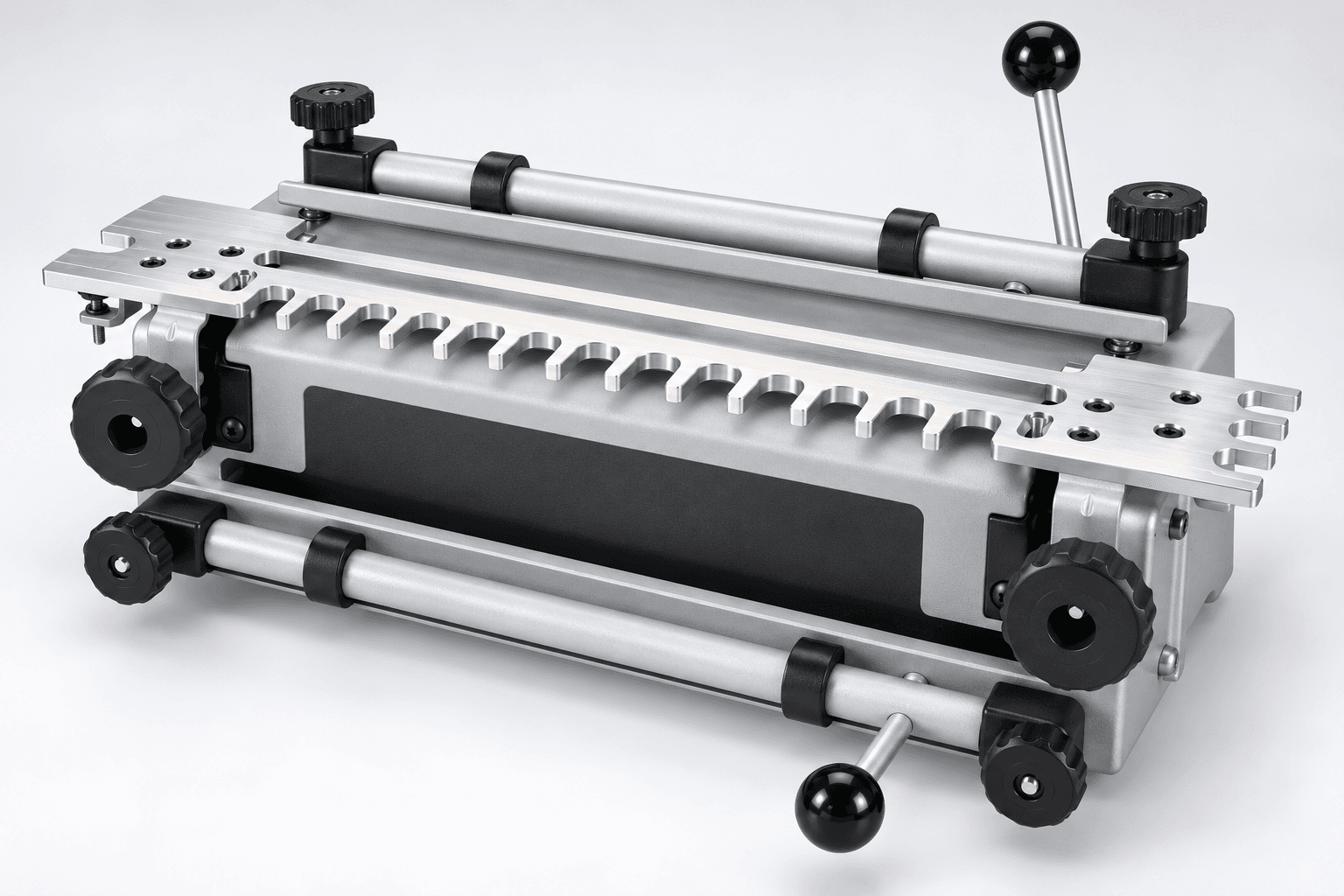 Original brand-neutral three-quarter studio rendering of a twelve-inch dovetail jig with a machined comb template, two cam-actuated clamping bars and side adjustment knobs.