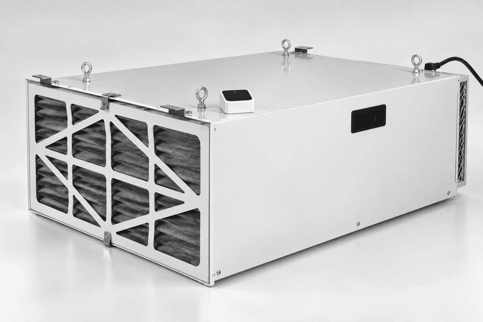 Original brand-neutral three-quarter studio illustration of a low rectangular U.S.-model workshop air cleaner with intake filter grille, side housing, four suspension eyes and rear power cord.